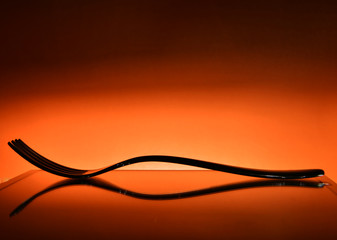 spoon and fork on an orange background
