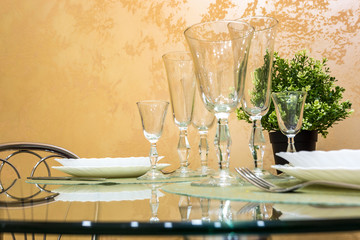 banquet table served with instruments and decorated with empty wine glasses