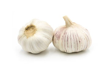 Two full garlic heads isolated on white background