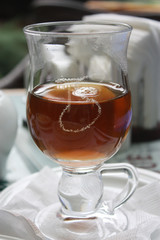 Black hot tea in clear glass Cup