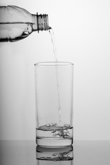 Glass of pure water on white background
