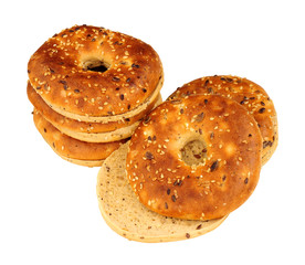 Group of multigrain covered bagels isolated on a white background