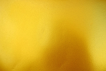 Gold Paint on Concrete Wall Texture Background. (Selective Focus)
