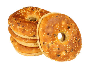 Group of multigrain covered bagels isolated on a white background