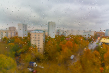 Cloudy rainy day at autumn in Moscow city (Russia). Sudden cold snap, drops on window glass and cityscape