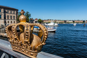 Gilded crown on the Skeppsholmsbron bridge in Stockholm, Sweden, Europe