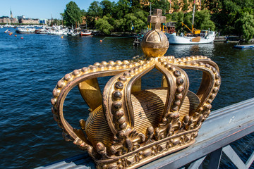 Gilded crown on the Skeppsholmsbron bridge in Stockholm, Sweden, Europe