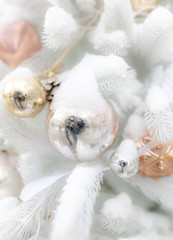 Toys on a white Christmas tree