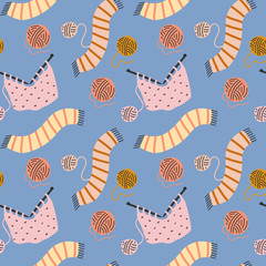 Hand drawn seamless vector pattern with knitting, scarf and balls of yarn. Endless background for textile fabric or wrapping paper. Decorative doodle wallpaper.
