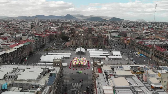 Aerial panoramic view of Mexico city main square, El Zocalo, drone slowly descening over the plaza