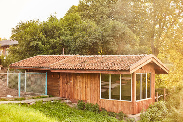 Fototapeta premium wooden extension in the bathhouse. Tiled Roof Wooden House