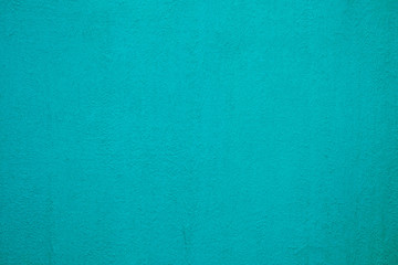 Beautiful Turquoise Painting on Stucco Wall Texture Background.