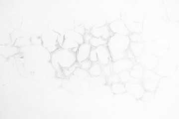 White Cracked Concrete Wall Texture Background with Light Leak from the Right.