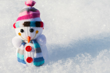 little snowman in the snow