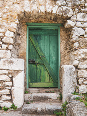 Fototapeta na wymiar old green doorway