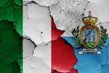 flags of Italy and San Marino painted on cracked wall