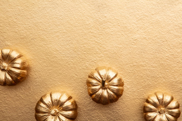 Golden thanksgiving pumpkin overhead flay lay composition