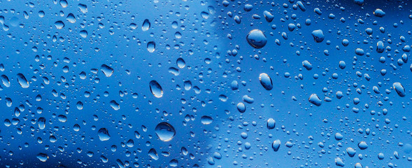 banner for website Water drop on the glass of windows background, raining on the glass off window city for background.