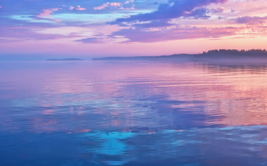 Naklejka na ściany i meble Misty Lilac Sunset Seascape With Sky Reflection