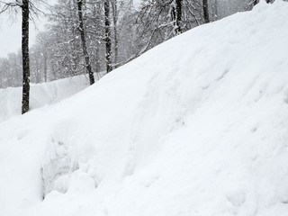 Winter landscape in the mountains of the Caucasus. Snowing.