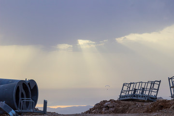 Construction of a ski lift in the mountains. Building structures - on a mountainside.  Away sea bay.