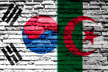 Flag of Algeria and South Korea on brick wall