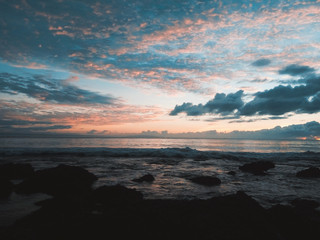 Fototapeta premium Pangandaran is one of West Java’s best kept-secrets as far as international tourists are concerned. Pangandaran offers uniquely black and white sand, calm waved beaches and spectacular sun