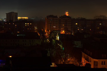 Fototapeta na wymiar fireworks over the city on New Year's Eve