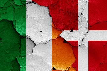 flags of Ireland and Denmark painted on cracked wall