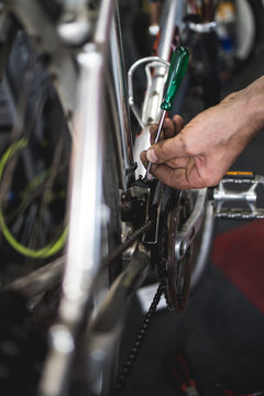 Fixing the bicycle problem in workshop,stock photo