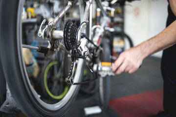 Fototapeta na wymiar Fixing the bicycle problem in workshop,stock photo