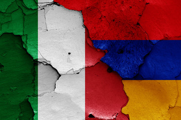 flags of Italy and Armenia painted on cracked wall