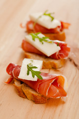 perfect sandwich made with rye bread cheese and Parma ham