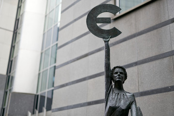 Brussels / Belgium - October 6th 2019: Statue of woman holding Euro symbol