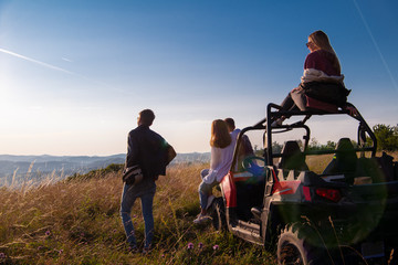 group of young people driving a off road buggy car © .shock