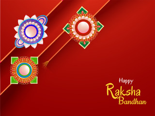 Traditional Decorative Rakhi on red background for Indian Festival of brother and sister bonding, Happy Raksha Bandhan. Can be used as greeting card design.