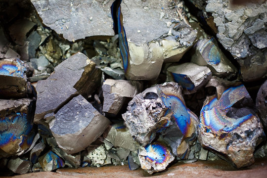 Pieces of ferrotitanium closeup. Ferroalloy used for alloying, deoxidation and degassing of steels and alloys