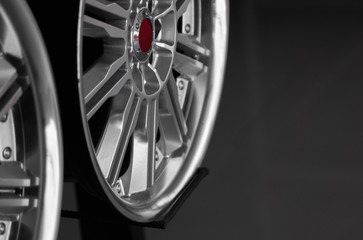 ar drives in the store with black background. Chrome car wheels for sale.