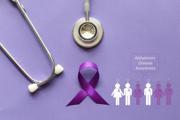 Stethoscope and person with purple ribbon on purple background, Symbol of Alzheimers awareness, Healthcare and medicine concept.