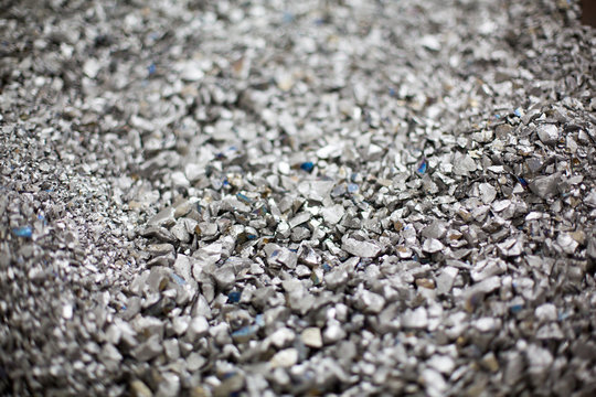Pieces of ferrotitanium closeup. Ferroalloy used for alloying, deoxidation and degassing of steels and alloys
