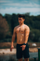 Energetic male athlete stretching