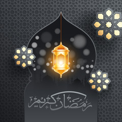 Ramadan Kareem text in Arabic language with hanging illuminated lantern and mandala pattern decorated on mosque door with grey islamic seamless pattern background.