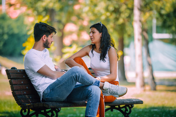 Happy attractive couple enjoying outdoors during sunset