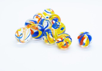 Colorful glass marbles isolated on white background.