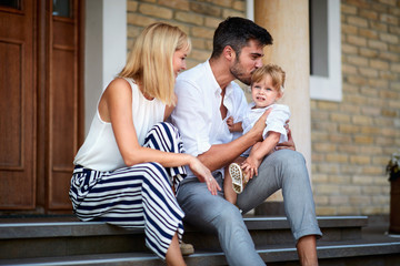 Father kissing his little daughter
