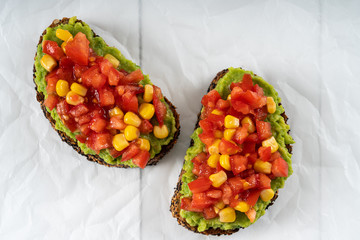 Avocado And Sweetcorn Salad On Toast With Tomatoes