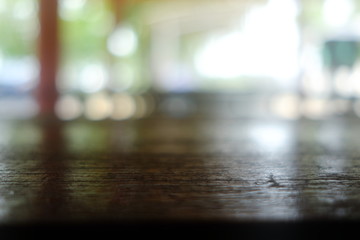 Close up Surface of Old Wooden Table in Cafe with Bokeh Background. (Selective Focus)