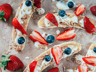 Banana Split With Strawberries, Blueberries, Almond Butter And Honey