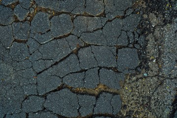 Obraz premium Close up Broken Asphalt Road Background.