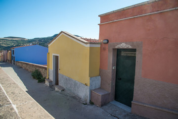 Fototapeta na wymiar Colorful houses and narrow alleys in Bosa, Sardinia